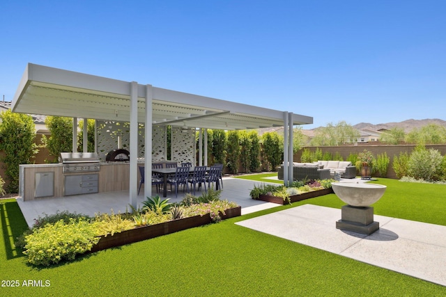 20797 W Rattler Rd, Buckeye, AZ 85396 - view of yard with an outdoor kitchen, an outdoor living space, and a patio