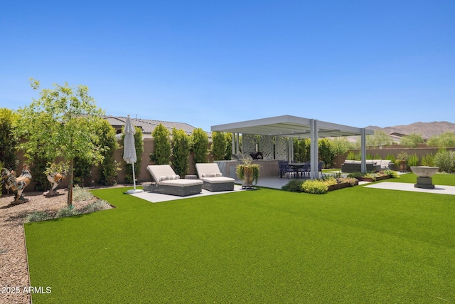 20797 W Rattler Rd, Buckeye, AZ 85396 - view of yard featuring a patio area and an outdoor kitchen