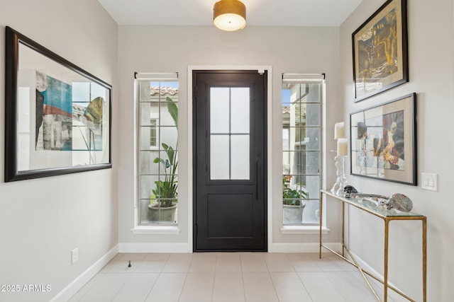 20797 W Rattler Rd, Buckeye, AZ 85396 - foyer entrance featuring baseboards, healthy amount of natural light, and light tile patterned flooring