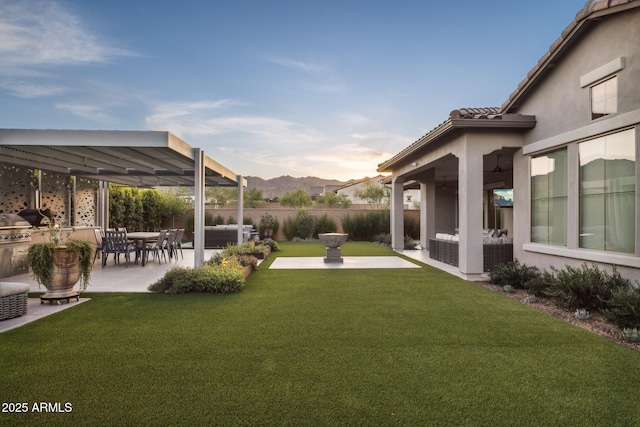 20797 W Rattler Rd, Buckeye, AZ 85396 - view of yard featuring a patio, ceiling fan, and a mountain view
