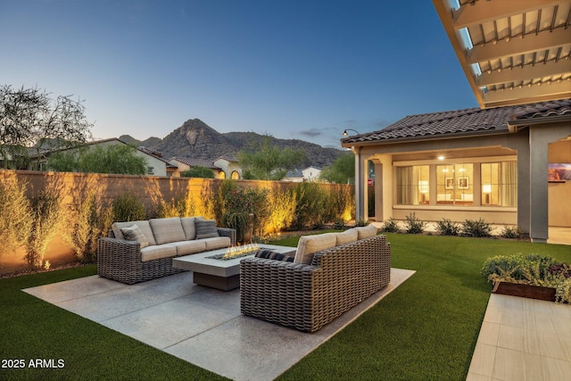 20797 W Rattler Rd, Buckeye, AZ 85396 - view of patio featuring an outdoor living space with a fire pit and a mountain view