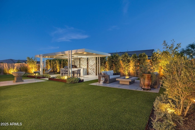 20797 W Rattler Rd, Buckeye, AZ 85396 - rear view of house with area for grilling, a patio area, and an outdoor living space