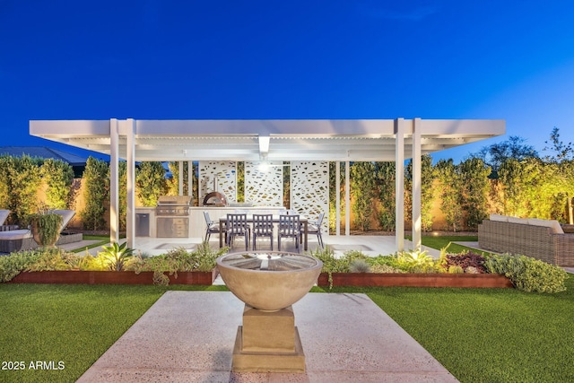 20797 W Rattler Rd, Buckeye, AZ 85396 - view of grassy yard featuring an outdoor kitchen, a patio, and outdoor dining area