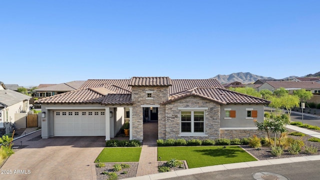 20797 W Rattler Rd, Buckeye, AZ 85396 - mediterranean / spanish-style home with stucco siding, stone siding, and a tiled roof