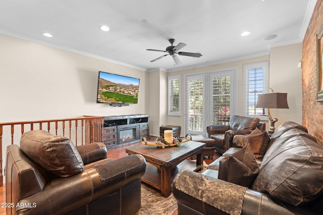 living area with ceiling fan, ornamental molding, recessed lighting, and wood finished floors