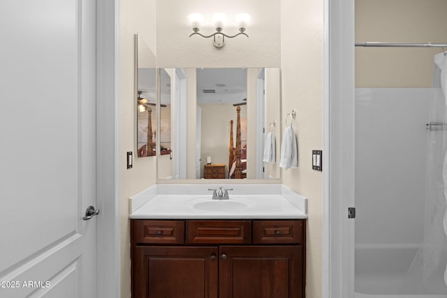 bathroom featuring vanity, ceiling fan, and a shower with curtain