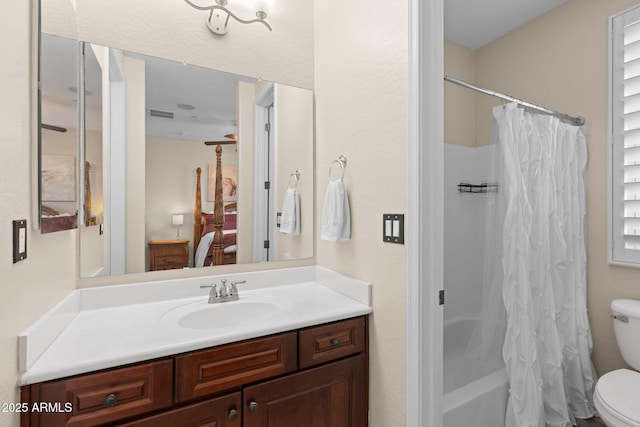 full bathroom with vanity, shower / tub combo with curtain, visible vents, and toilet