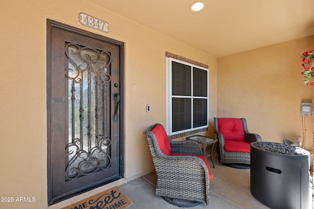 property entrance with stucco siding