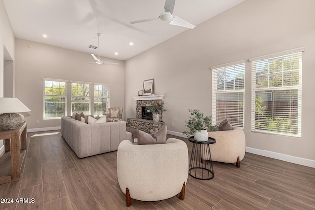 living room with a wealth of natural light, ceiling fan, and hardwood / wood-style flooring