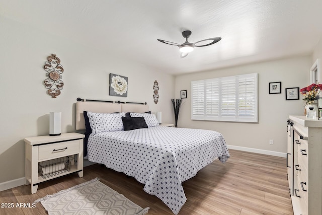 bedroom featuring ceiling fan and light hardwood / wood-style floors