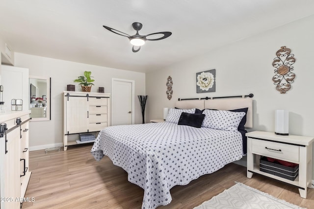 bedroom featuring light hardwood / wood-style floors and ceiling fan