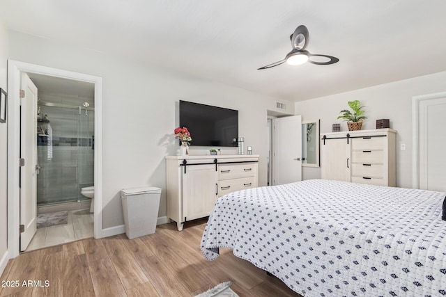 bedroom with ensuite bath, ceiling fan, and light wood-type flooring