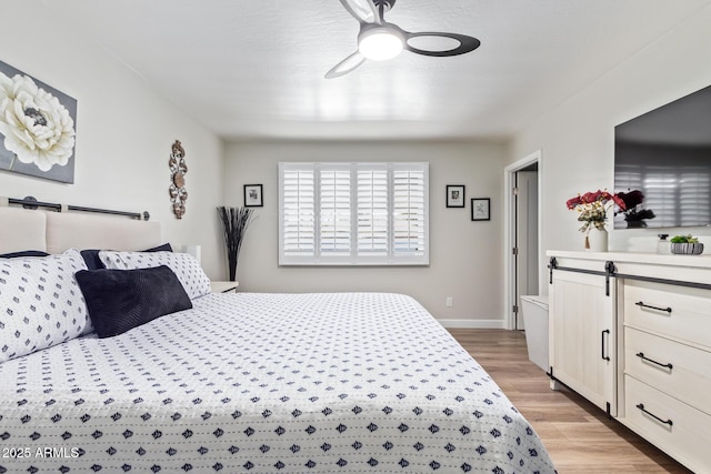 bedroom featuring ceiling fan and light hardwood / wood-style floors