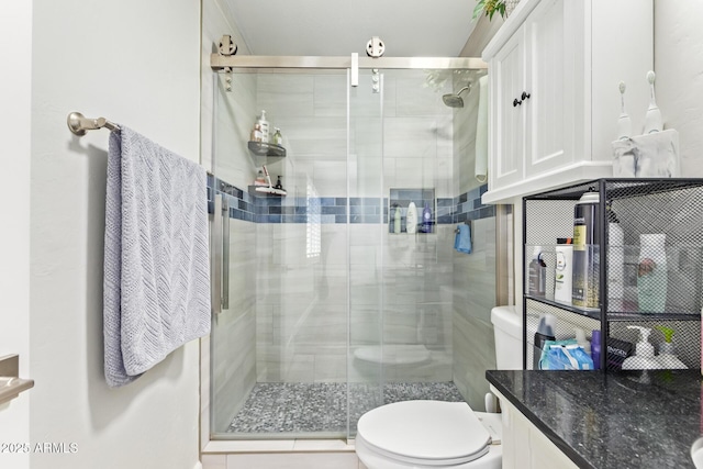 bathroom featuring walk in shower and toilet