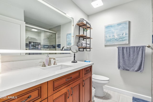 bathroom with a shower with door, vanity, and toilet