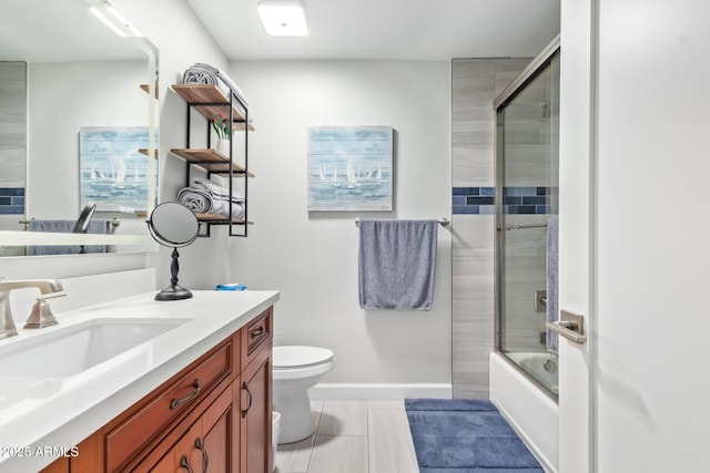 full bathroom with vanity, combined bath / shower with glass door, and toilet