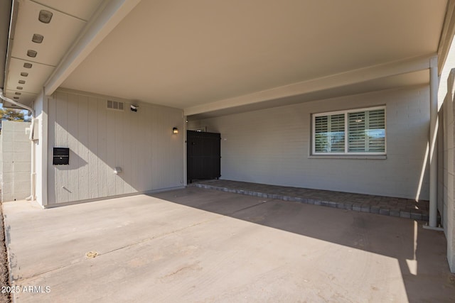 view of patio / terrace with a carport