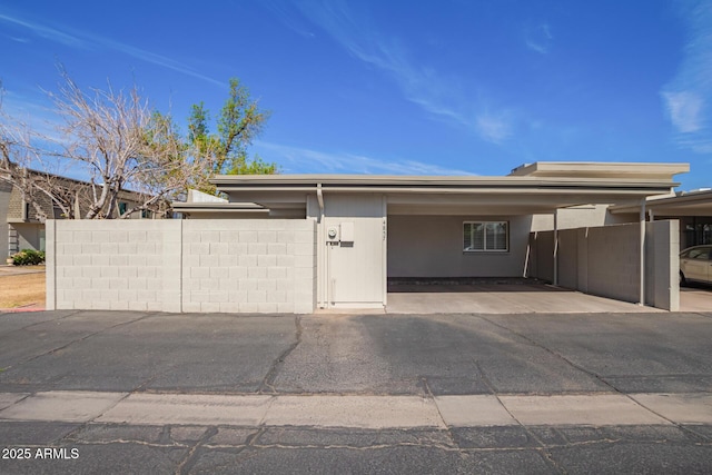 view of front of property with a carport