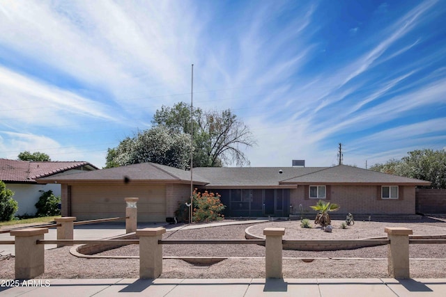 1158 N Barkley St, Mesa, AZ 85203 - ranch-style home with a sunroom, an attached garage, brick siding, and driveway