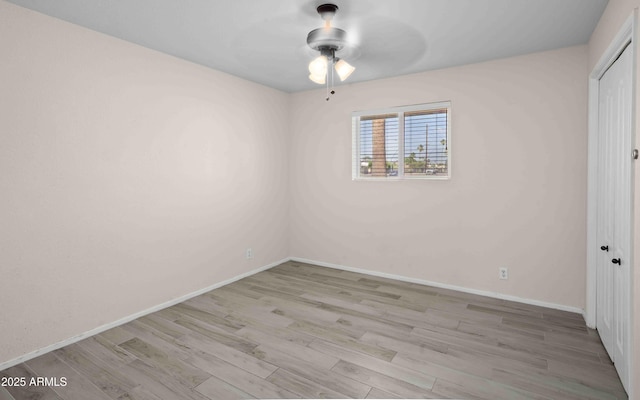 1158 N Barkley St, Mesa, AZ 85203 - unfurnished bedroom with a closet, wood finished floors, and ceiling fan