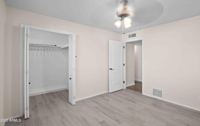 1158 N Barkley St, Mesa, AZ 85203 - unfurnished bedroom with light wood-style floors, a closet, and ceiling fan