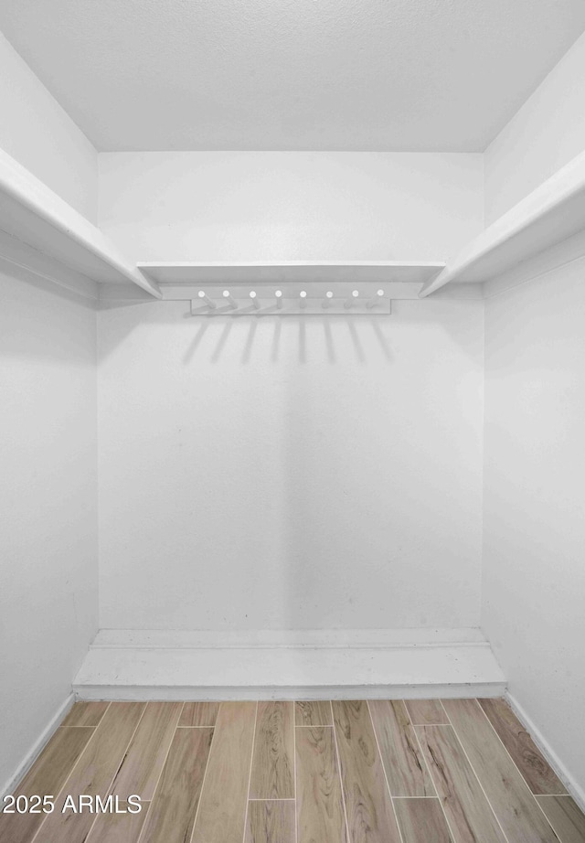 1158 N Barkley St, Mesa, AZ 85203 - walk in closet with wood finished floors