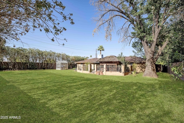 1158 N Barkley St, Mesa, AZ 85203 - fenced backyard with a gazebo and an outdoor structure
