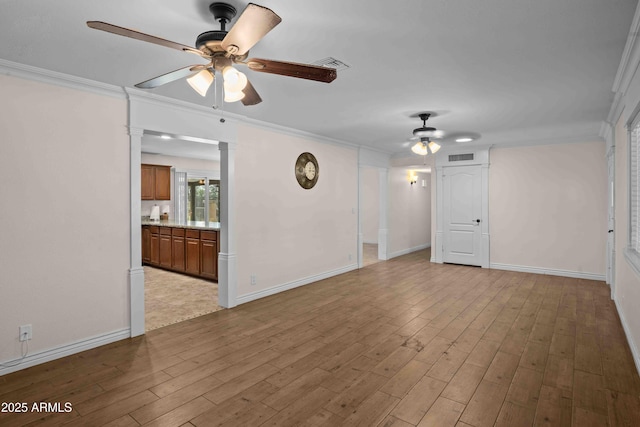 1158 N Barkley St, Mesa, AZ 85203 - unfurnished room with a ceiling fan, crown molding, and wood finished floors
