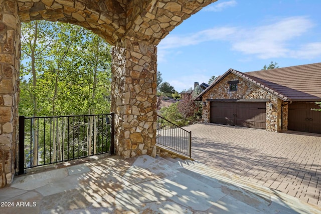 view of patio / terrace with a garage