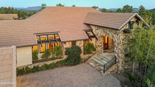 rear view of property featuring a mountain view