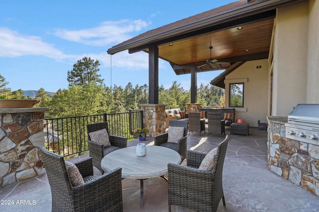 view of patio / terrace featuring ceiling fan, area for grilling, and a balcony