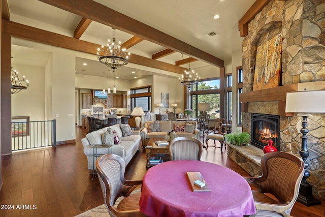 dining room featuring a fireplace, beamed ceiling, and dark wood-type flooring