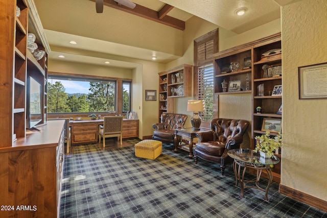 home office with beamed ceiling, a textured ceiling, and built in desk