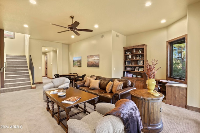 carpeted living room featuring ceiling fan