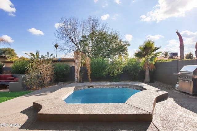 view of pool featuring a patio area and a fenced backyard