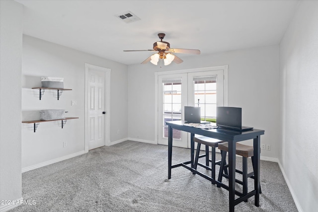 carpeted home office featuring ceiling fan and french doors