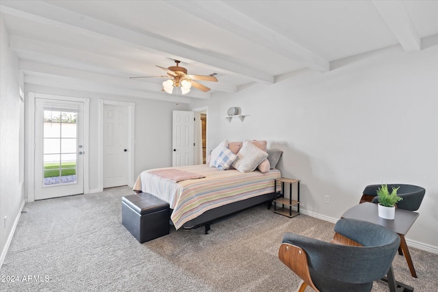 carpeted bedroom with ceiling fan and beamed ceiling