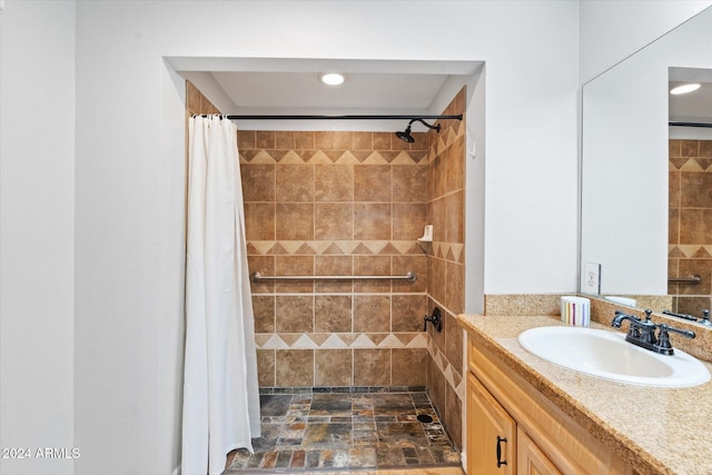 bathroom with a shower with curtain and vanity