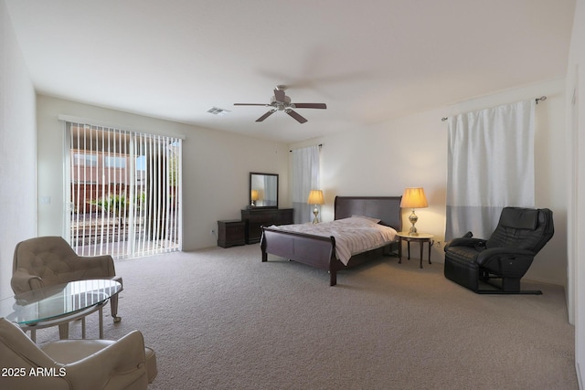 carpeted bedroom with a ceiling fan, visible vents, and access to exterior