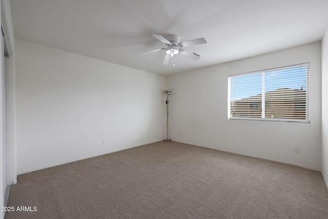 empty room with light carpet and ceiling fan