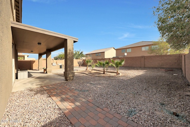 view of yard with a fenced backyard and a patio