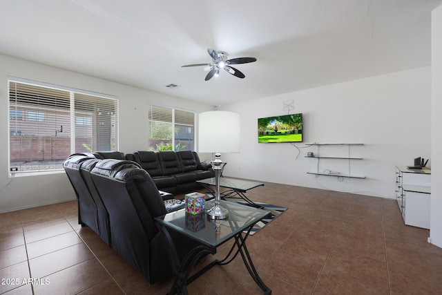 tiled living area featuring visible vents and a ceiling fan