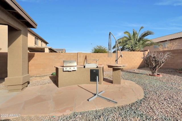 view of patio featuring area for grilling and a fenced backyard