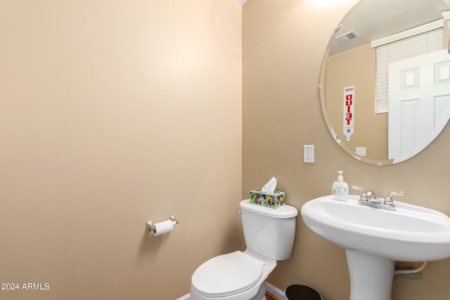 bathroom with toilet and sink