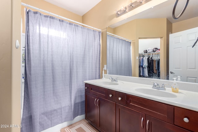 bathroom with vanity and a shower with shower curtain