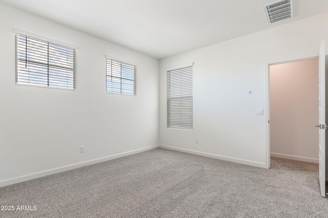 spare room featuring carpet