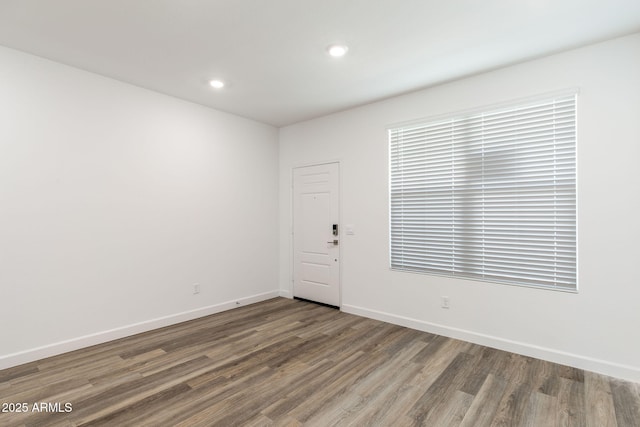 unfurnished room featuring hardwood / wood-style floors