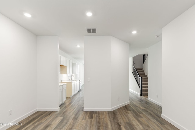 interior space featuring dark hardwood / wood-style flooring and sink