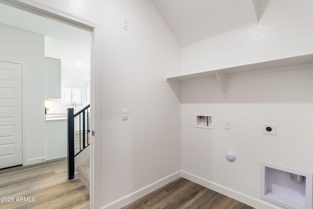 washroom featuring washer hookup, hookup for an electric dryer, gas dryer hookup, and wood-type flooring