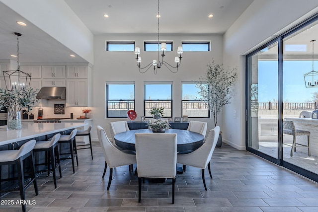 dining room with a wealth of natural light and an inviting chandelier